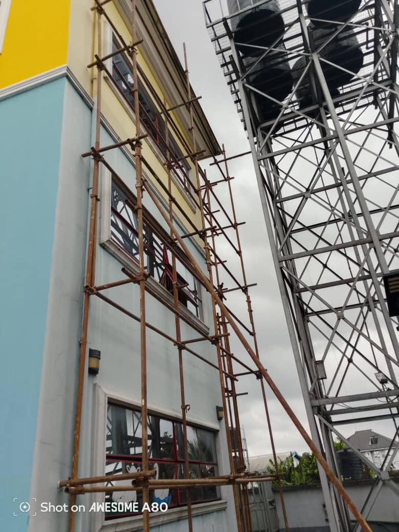 Colourful building painting scaffold